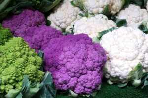 different varieties of cauliflower on a market