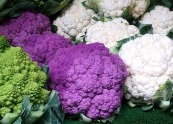 different varieties of cauliflower on a market