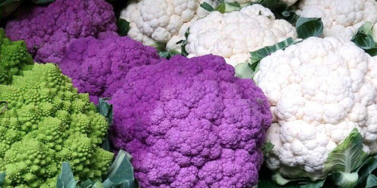 different varieties of cauliflower on a market