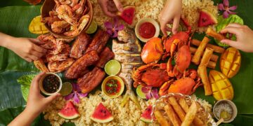 Filipino family enjoying Christmas dinner Noche Buena feast with traditional dishes and celebration
