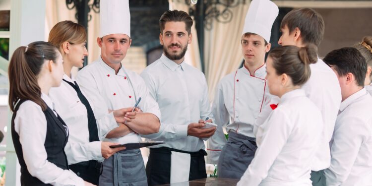 Staff Productivity restaurant staff listen to chef