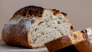 Artisan sourdough bread with crusty exterior demonstrating wild yeast fermentation home baking results