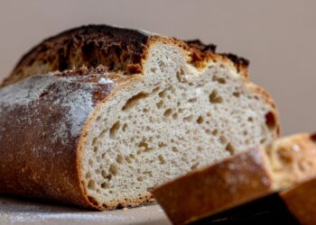 Artisan sourdough bread with crusty exterior demonstrating wild yeast fermentation home baking results