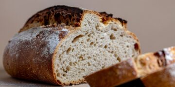 Artisan sourdough bread with crusty exterior demonstrating wild yeast fermentation home baking results
