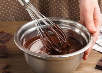Chocolate tempering technique with professional methods showing melting chocolate for home chocolate making