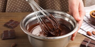 Chocolate tempering technique with professional methods showing melting chocolate for home chocolate making