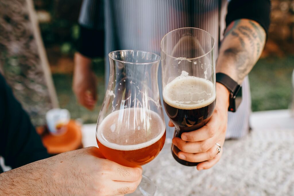 Engaged attendees socializing at beer workshop tasting event with music