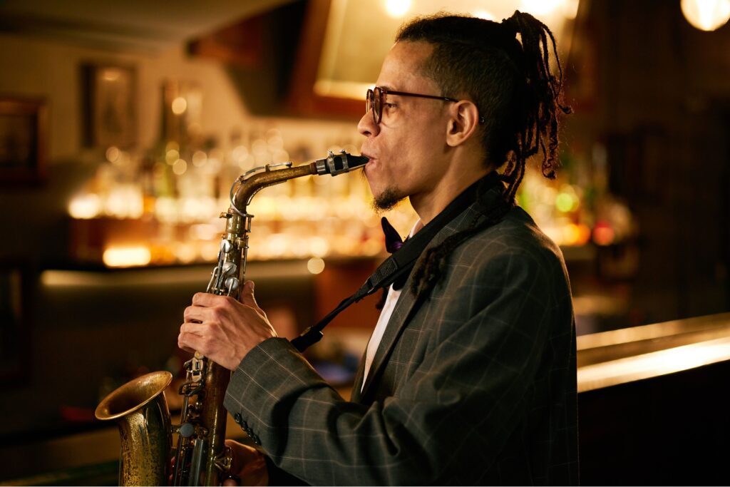 Musician in live acoustic performance at craft beer workshop