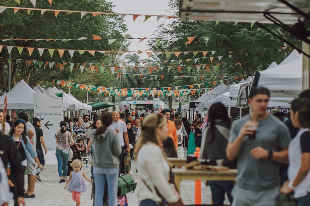 A group of people enjoy French street food together at a Bastille Day community event