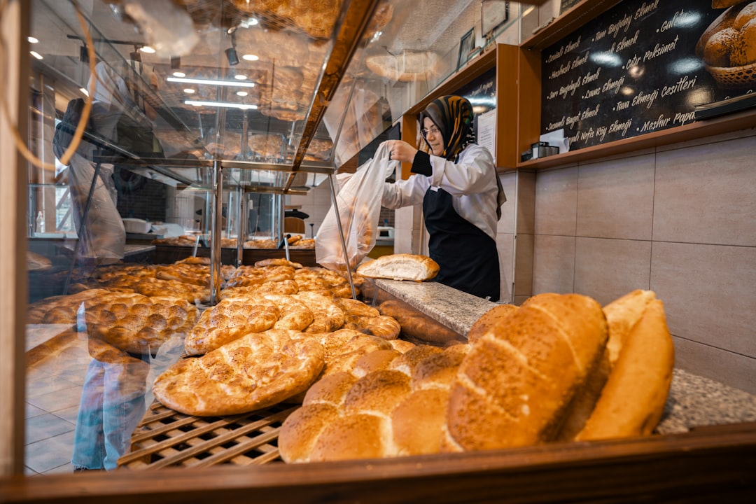 a turkish baker woman in the baker shop with flat breads