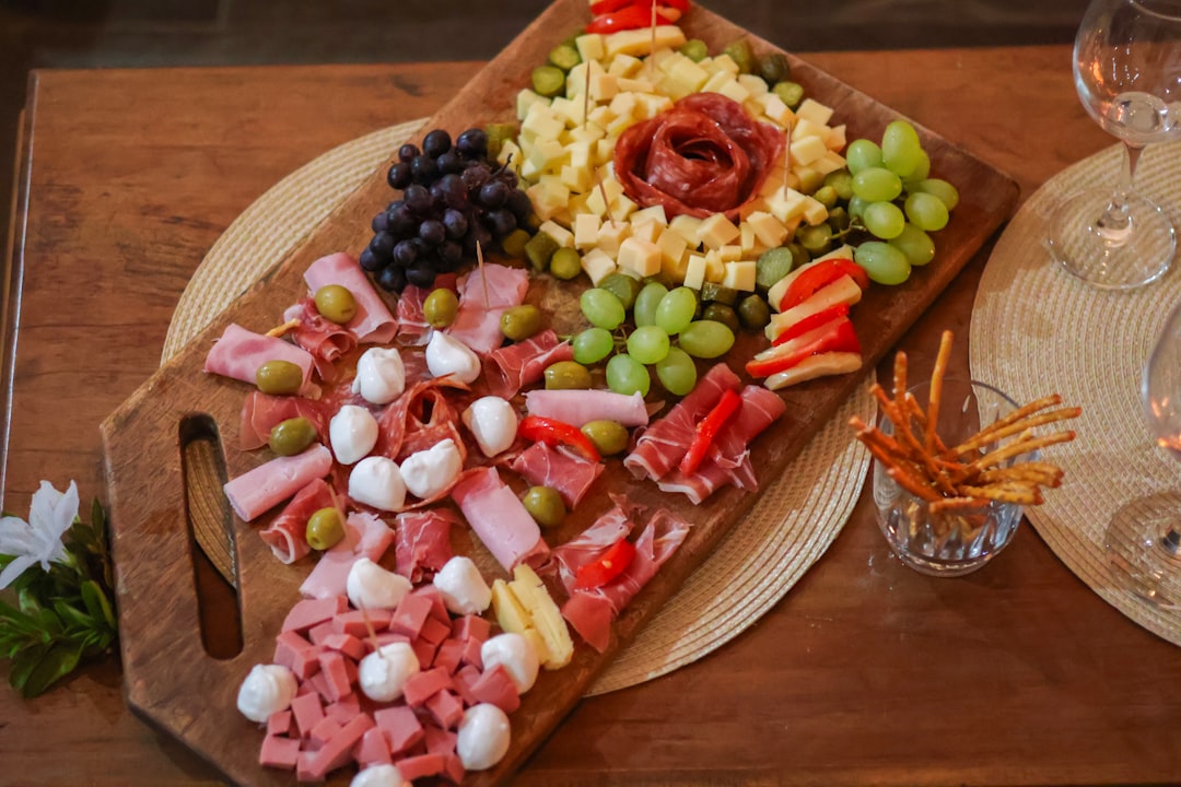 a summer grazing board filled with seasonal fruits, fermented condiments, and global pantry staples