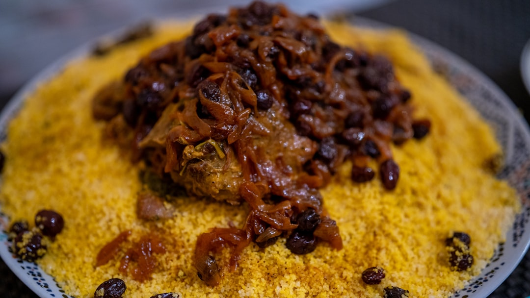 Traditional Moroccan cuisine served in a clay tagine pot at a local restaurant