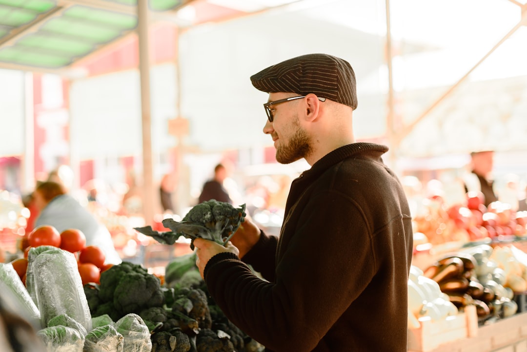 A restaurant manager inspecting fresh seasonal produce with a local supplier