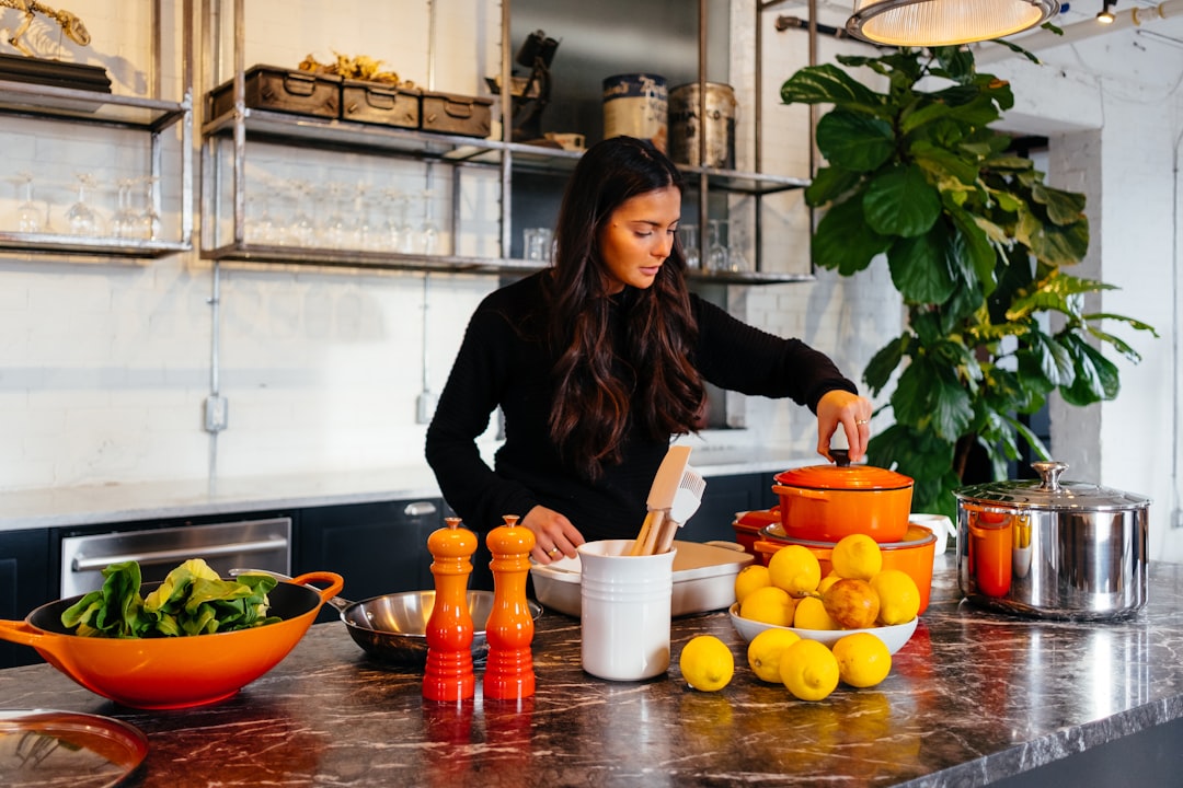 A home cook finishing a roasted tomato sauce in a pan on the stovetop, capturing what define a great tomato sauce