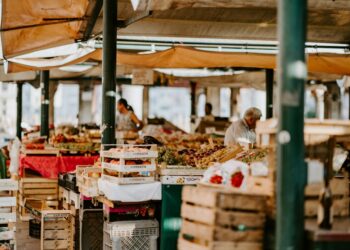 An indigenous producer displays heritage vegetables at a market stall, representing the spirit of Terra Madre.