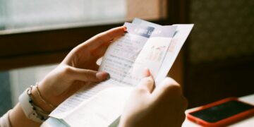 Restaurant owner checking energy relief eligibility on a bill
