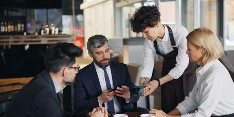 Restaurant manager briefing staff on new tipping rules